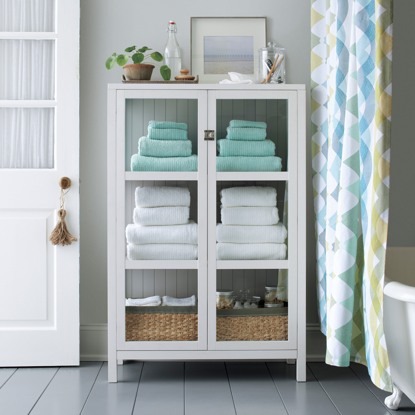 Bathroom floor cabinet with towel bar